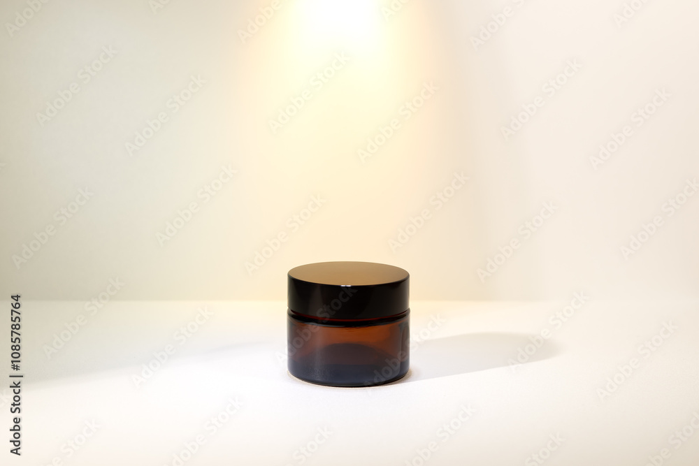 Cosmetic mockup - jars for cream, essential oil bottle of amber glass on Minimalist amber glass dropper bottle for essential oils, skincare serums, or cosmetic products isolated on white background Cosmetic mockup - jars for cream, essential oil bottle of amber glass on Minimalist amber glass dropper bottle for essential oils, skincare serums, or cosmetic products isolated on white background
