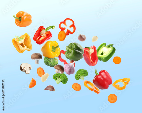 Wallpaper Mural Many different fresh vegetables in air on light blue gradient background Torontodigital.ca