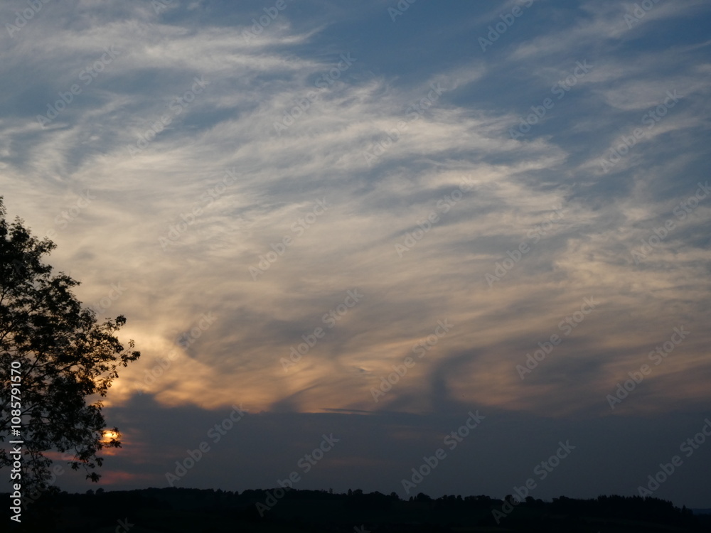 High windswept cirrus clouds at sunset over the Wye Valley, Herefordshire High windswept cirrus clouds at sunset over the Wye Valley, Herefordshire