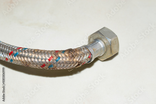 water hose to the mixer with a cracked and rusty braid. replacement is necessary.