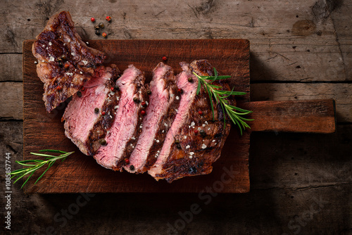 Grilled Beef Steak Sliced ​​on Wooden Cutting Board