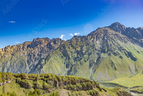 Obraz na płótnie Caucasian mountains near Gergeti village, Stepansminda. Kazbegi mountain behind the clouds. Georgia w salonie