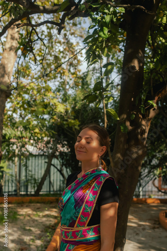 Indian Traditional Beautiful young girl in saree posing outdoors. Happy Diwali greeting photo. Part of a series photo