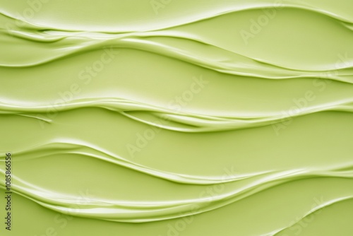 Bright green glossy plastic surface with embossed textures creating a modern and vibrant design effect