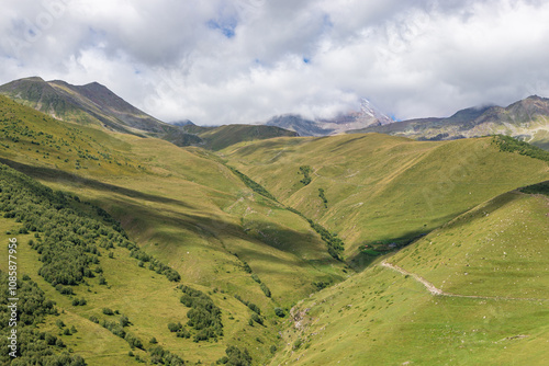 Obraz na płótnie Caucasian mountains near Gergeti village, Stepansminda. Kazbegi mountain behind the clouds. Georgia w salonie