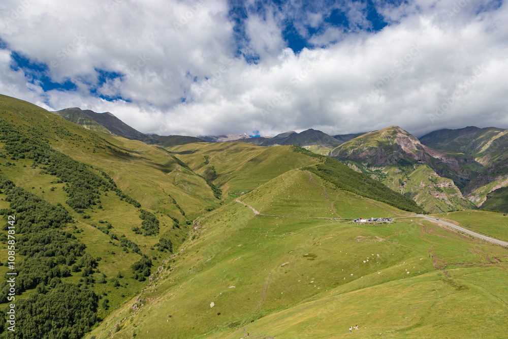 Caucasian mountains near Gergeti village, Stepansminda. Kazbegi mountain behind the clouds. Georgia