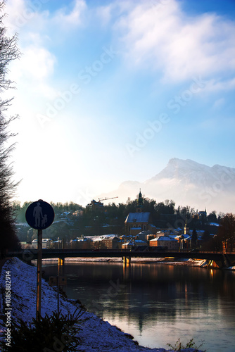 SALZBURG, AUSTRIA - 01.13.2024: View of Salzach mountain and Historic city of Salzburg with Salzach river in Austria in winter. photo