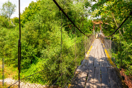 One of the two suspension footbridges over Vidima River in the Bulgarian Fore-Balkan village of Debnevo, Troyan Municipality photo