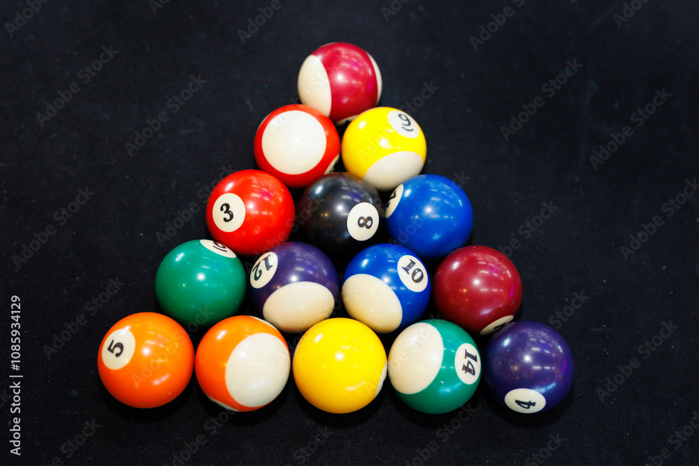 Billiard balls lie in the shape of a triangle on the table and are ready to play. Billiard balls lie in the shape of a triangle on the table and are ready to play.