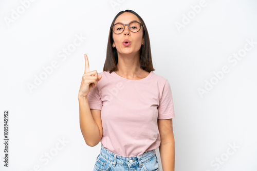 Young caucasian woman isolated on white background intending to realizes the solution while lifting a finger up