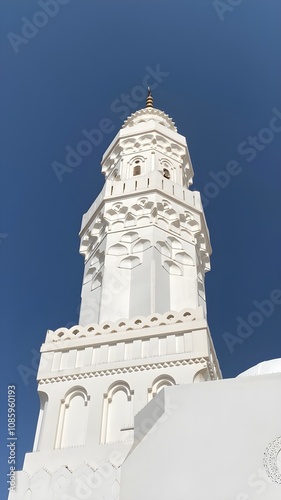 The minaret of masjid Quba at noon photo