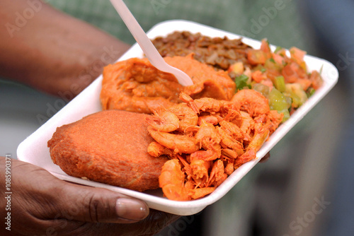 Acaraje. Traditional Brazilian food, made with vatapá, caruru and dried shrimp. photo