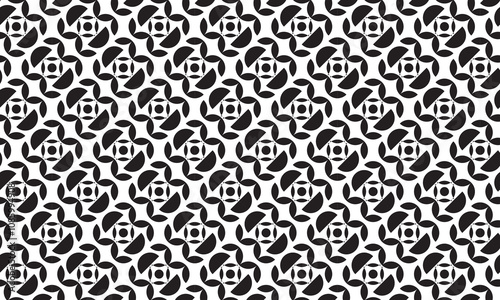 Batik themed seamless geometric pattern in the form of black flowers on a white background. Perfect for printing, design and textiles