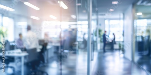 Obscured Office Space Showing Busy Professionals Through Glass