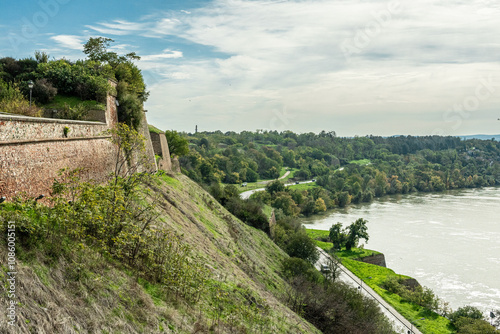 The fortress perched on Petrovaradin Hill watches over the city, while the charming streets and modern buildings of Novi Sad are spread out, creating a perfect blend of history and contemporary life