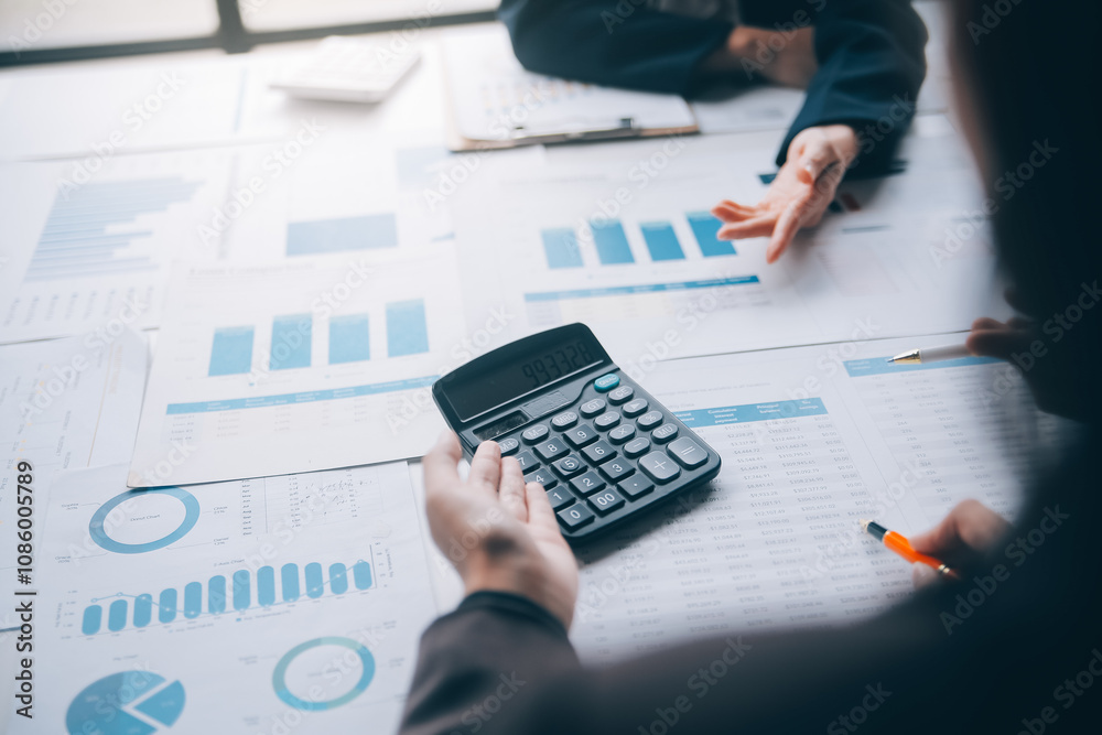 Accountant or banker making calculations Bookkeeper Clerk, Bank Advisor And Auditor. Accounting concept. Accountant or banker making calculations Bookkeeper Clerk, Bank Advisor And Auditor. Accounting concept.
