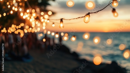 A string of lights hangs from a tree overlooking the ocean, perfect for evening ambiance or decoration