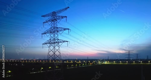 High voltage electricity towers at dusk