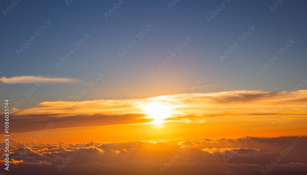 Sun Setting Over Clouds in Sky and Copy Space Sun Setting Over Clouds in Sky and Copy Space