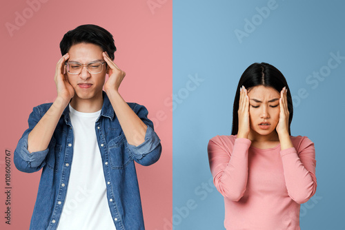 Got sick. Asian sad couple having headache, touching their temples over grey background photo