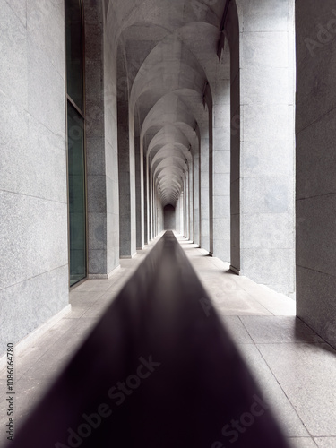 A long hallway with a bold black line leading away into the distance, framed by a series of elegant arches. Perfect for architectural, abstract backgrounds or heritage-inspired designs