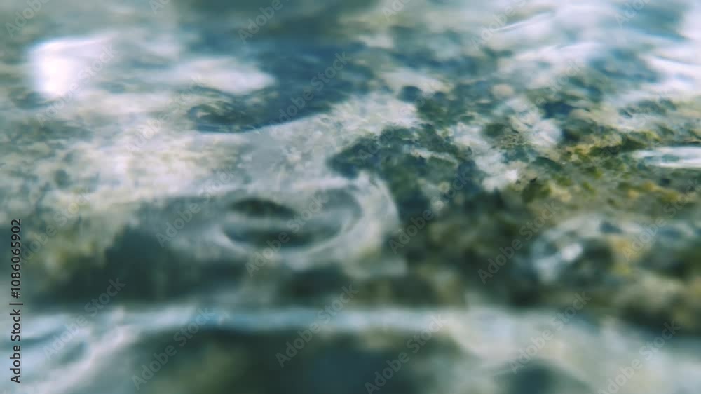 static close-up of rolling waves on a smooth stone in slow motion static close-up of rolling waves on a smooth stone in slow motion