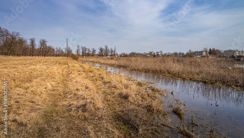 Field with a river running through it