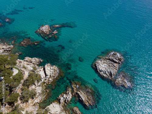 Wallpaper Mural Aerial top down of rocks in blue water Mediterannean Sea along Costa Brava Palamos Catalonia Spain Torontodigital.ca
