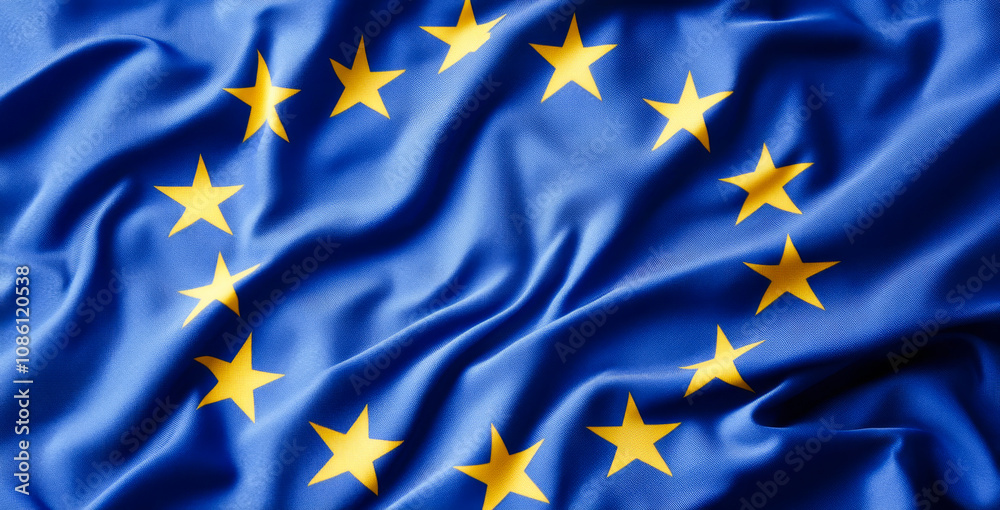 A blue and yellow flag with stars in the center. The flag is from Europe. The flag is waving in the wind A blue and yellow flag with stars in the center. The flag is from Europe. The flag is waving in the wind
