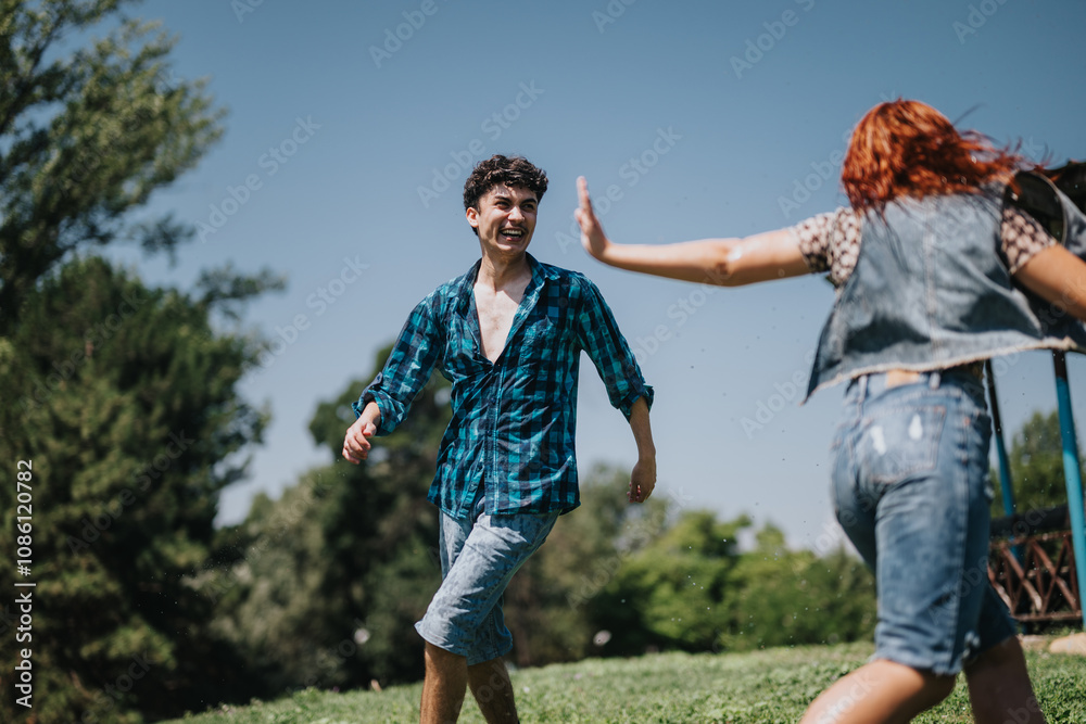 Group of friends enjoying a sunny day at the park, splashing water and sharing laughter near the fountain. Group of friends enjoying a sunny day at the park, splashing water and sharing laughter near the fountain.