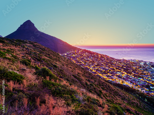 Obraz na płótnie After sunset view of Camps Bay and Bakoven lit up on the slopes of Lion's Head mountain, Cape Town, South Africa w salonie