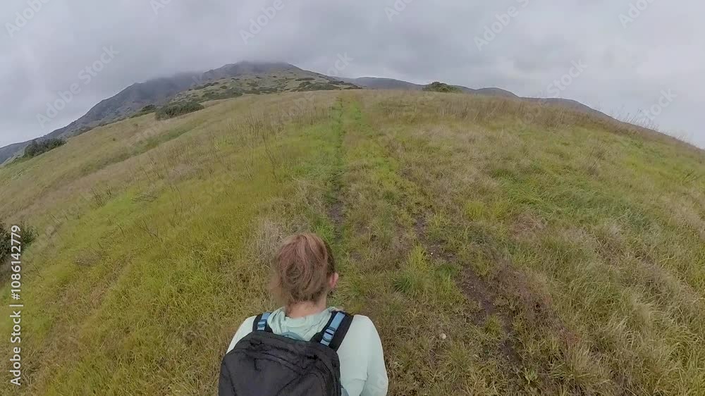 Overhead of Woman Hiking Across Grassy Field in Channel Islands National Park