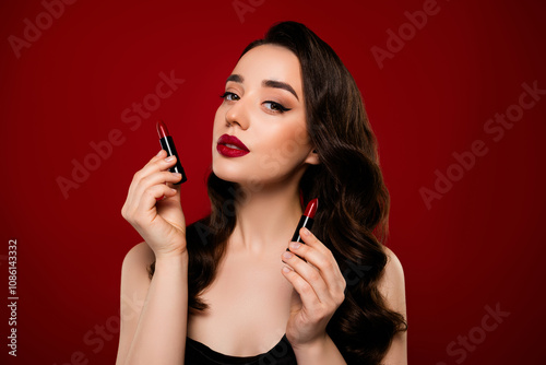 Portrait of gorgeous attractive lady advertising pomade preparing festival event isolated on red color background