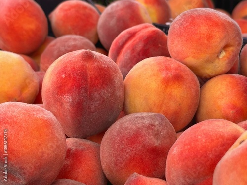 a ripe peach grown in the sun, lying on the store counter and ready to eat