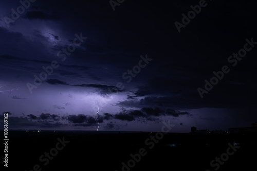 lightning in the night sky over the city