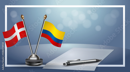 Denmark and Colombia National flags on small table with bokeh background, cooperative relationship