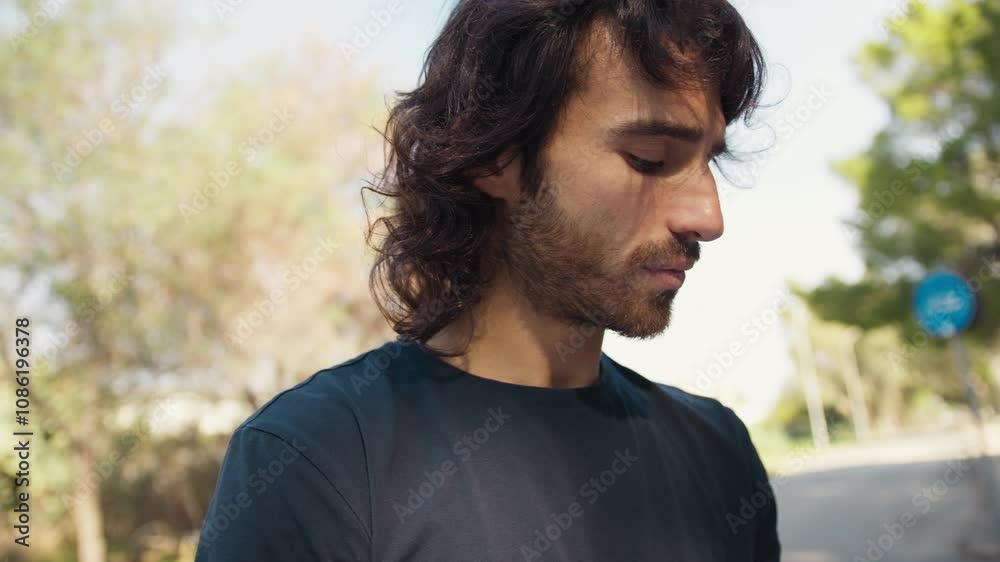 Man Talks Sadly About Mourning With Relatives In Park Outdoors Man Talks Sadly About Mourning With Relatives In Park Outdoors