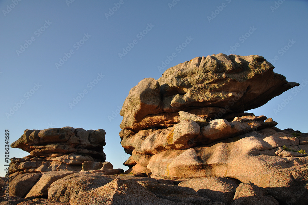 Pink granite rocks at the coast in Brittany , France Pink granite rocks at the coast in Brittany , France