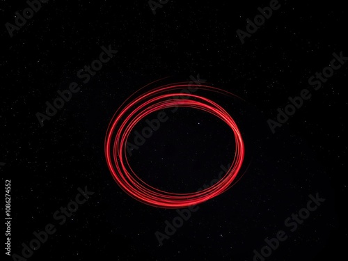 Red spiral light trails in a starry sky with stars and planets, ethereal colors, starry night photography photo