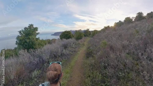 Overhead of Woman Hiking the Del Norte Trail at Sunrise in Channel Islands National Park photo