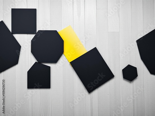 Geometric shapes in black and grey with vibrant yellow highlights on a modern wall background, colorblock, abstractpainting photo