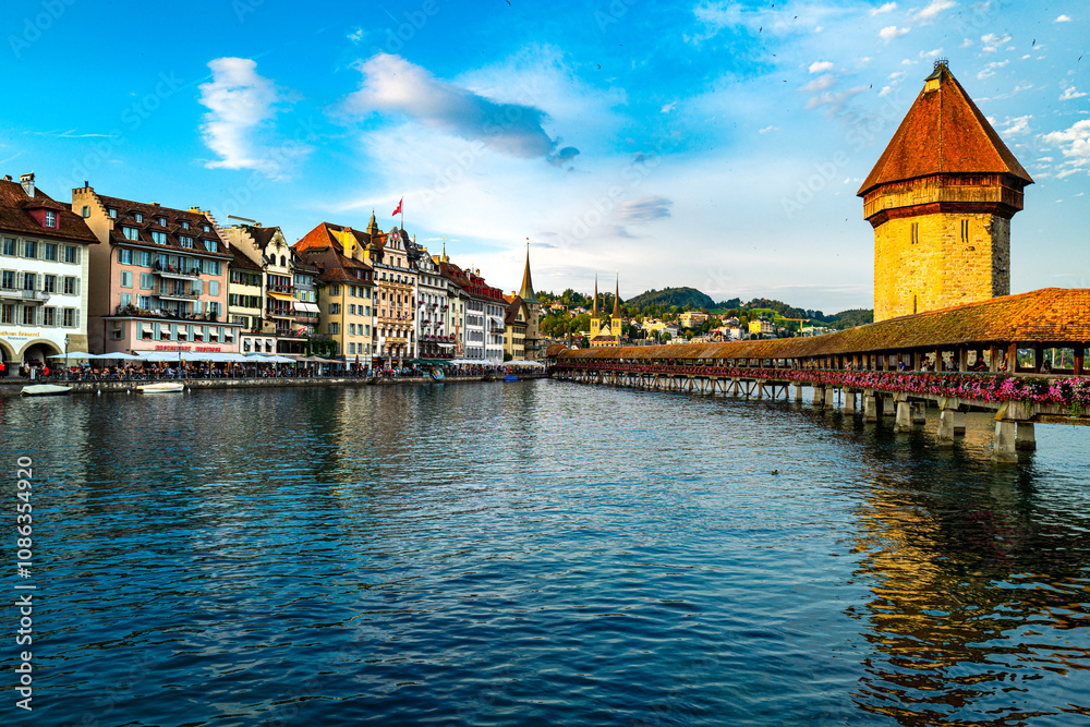 Lucern city with famous Chapel Bridge. Lucerne city view. Canton of Lucerne. Lucern Switzerland. Sunrise in historic city center of Lucerne with famous Chapel Bridge and lake Lucerne. Lucern city with famous Chapel Bridge. Lucerne city view. Canton of Lucerne. Lucern Switzerland. Sunrise in historic city center of Lucerne with famous Chapel Bridge and lake Lucerne.