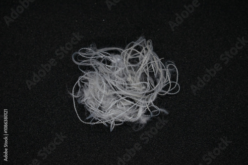Messy and tangled white threads on Black background