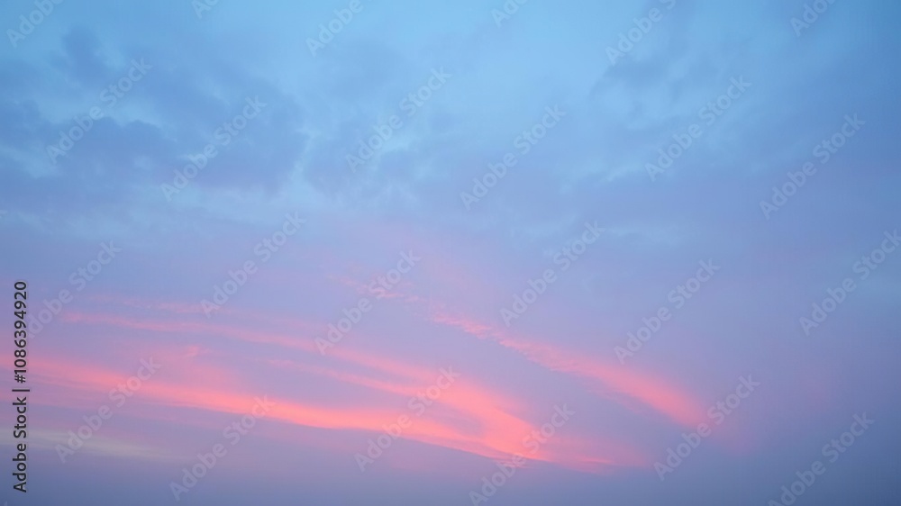 Soft pink and blue hues spread across a cloudy sky at dawn, spring morning, garden scene, early morning sun Soft pink and blue hues spread across a cloudy sky at dawn, spring morning, garden scene, early morning sun