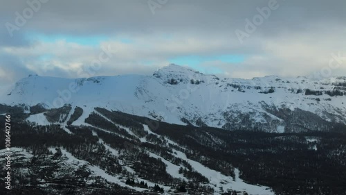 Stunning aerial view of snow-covered Chapelco Hill in Patagonia, Neuquén, Argentina photo