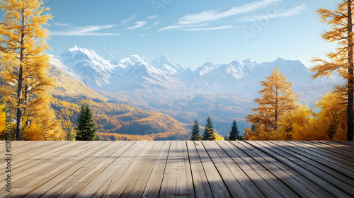 Wooden deck overlooking an autumn mountain range with larch trees