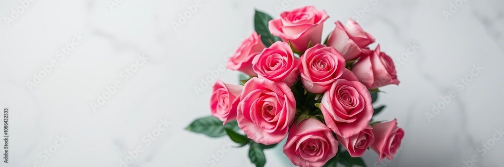 Overhead view of a pink rose bouquet arranged in a vase, decorative centerpiece, floral design, vase arrangement Overhead view of a pink rose bouquet arranged in a vase, decorative centerpiece, floral design, vase arrangement