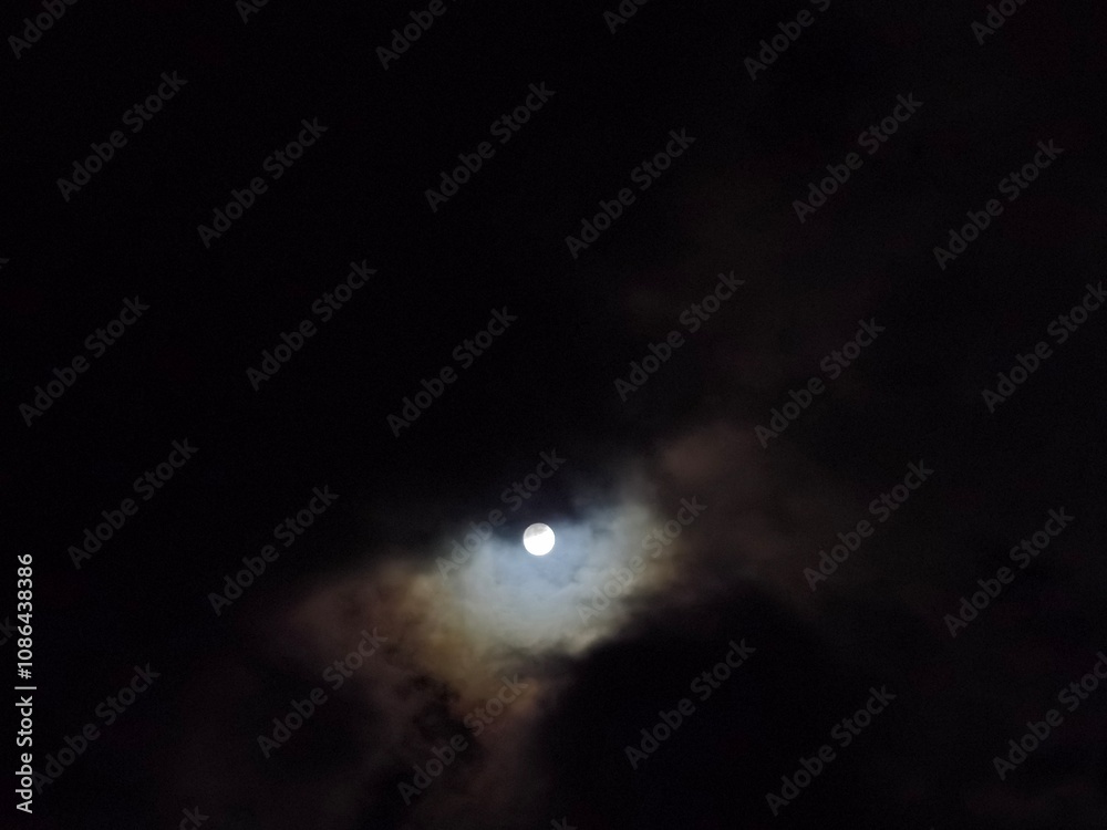 Serene Moonrise: Eye of the Night Amidst Clouds Serene Moonrise: Eye of the Night Amidst Clouds