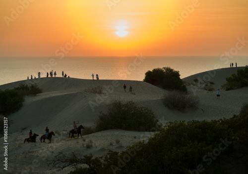 Fototapeta Naklejka Na Ścianę i Meble -  Sunset on the sand dunes of Patara. Turkey's popular Mediterranean coast. Kalkan town, Kas province, Turkey