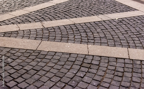 An ancient square covered with granite paving stones photo